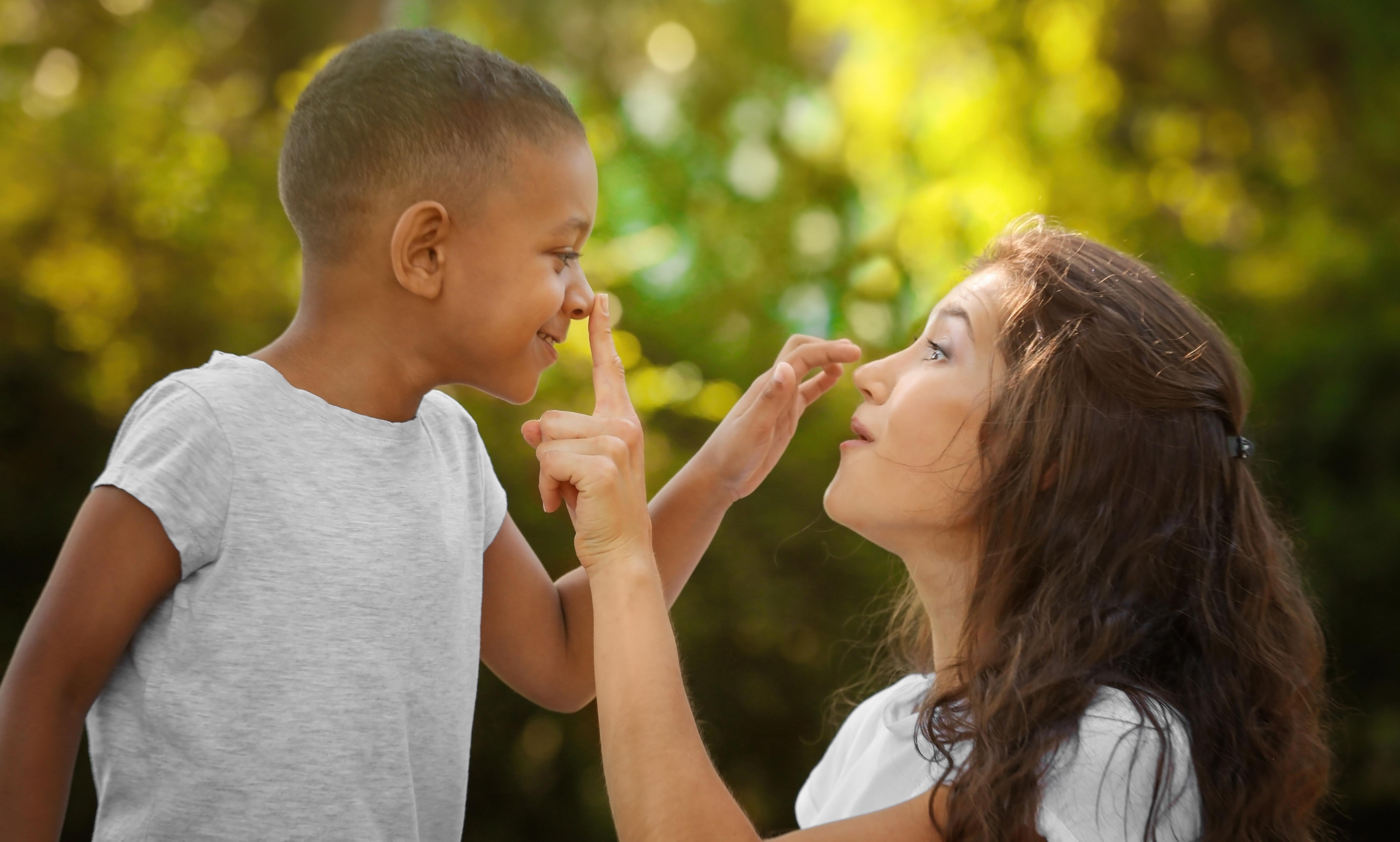 mother touching foster child's nose