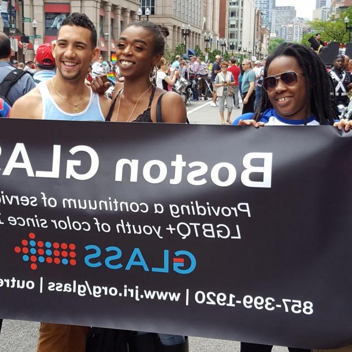 Young adults holding banner